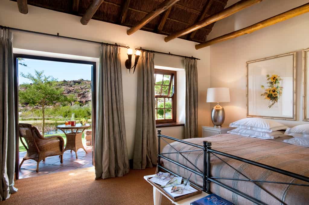 Double or twin sharing accommodation, with views of the landscaped indigenous gardens and one of the three nearby swimming pools.