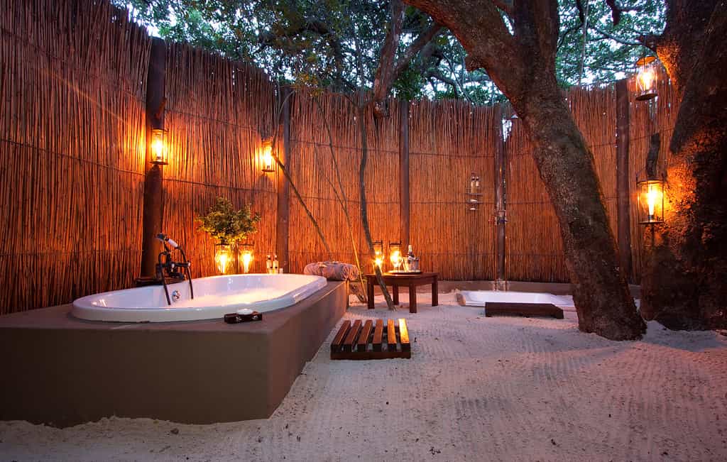 The romantic open-air bathrooms offer a unique experience.  Enjoy the forest canopy with the stars peeking through as you relax in your bubble bath.