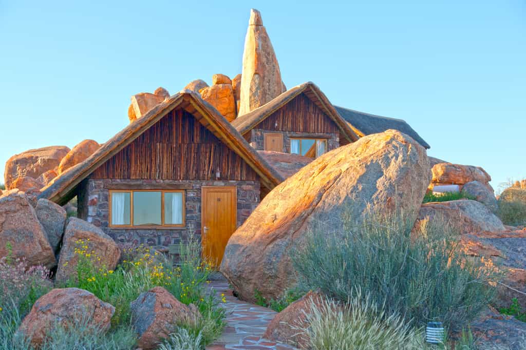 View of the rooms nestled against the boulders. 