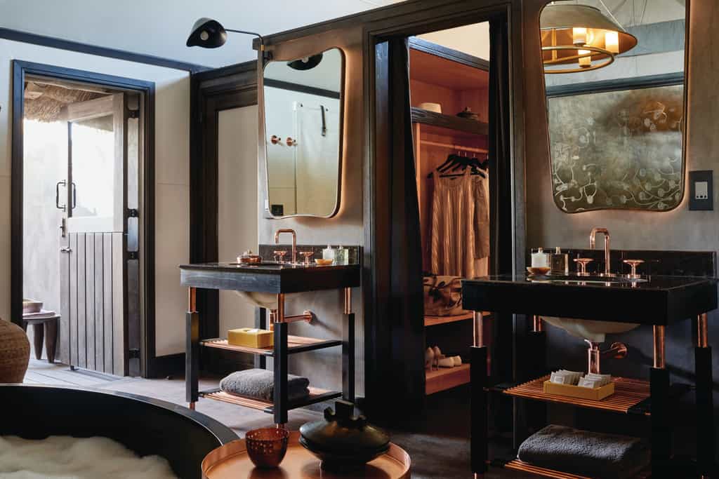 Featuring a double basin, indoor and outdoor shower, oversized bath and a walk-in cupboard