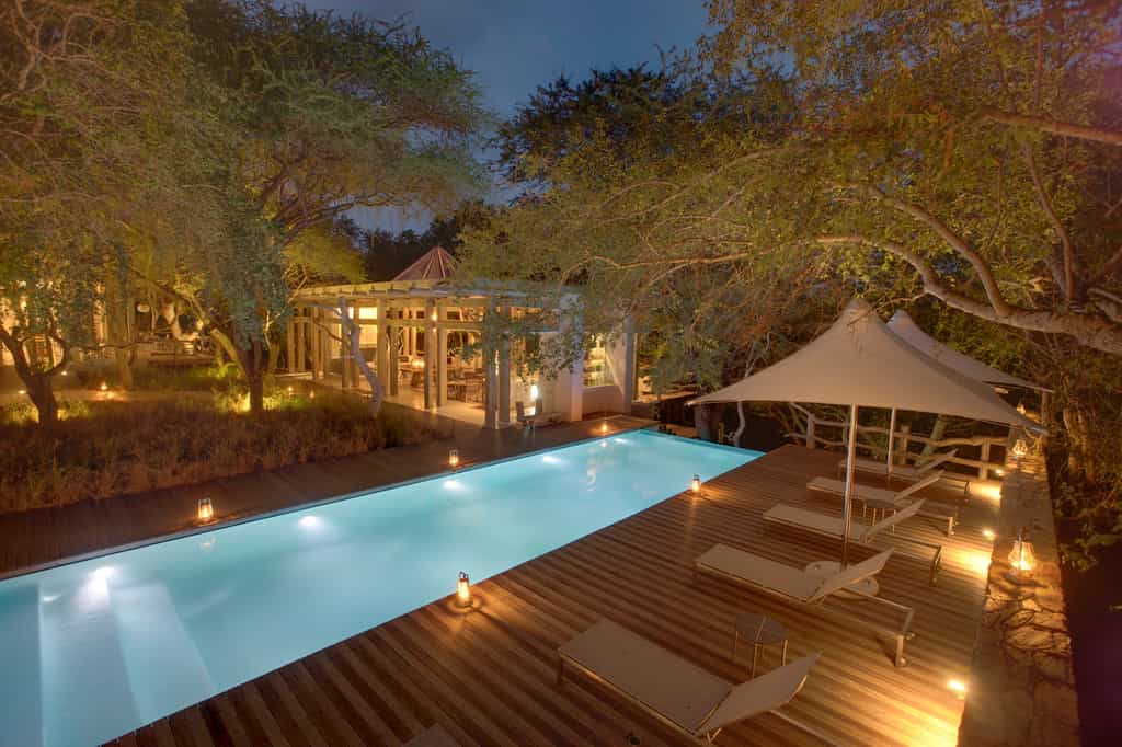 The Pool deck has sun loungers and seamless views over the Klaserie River