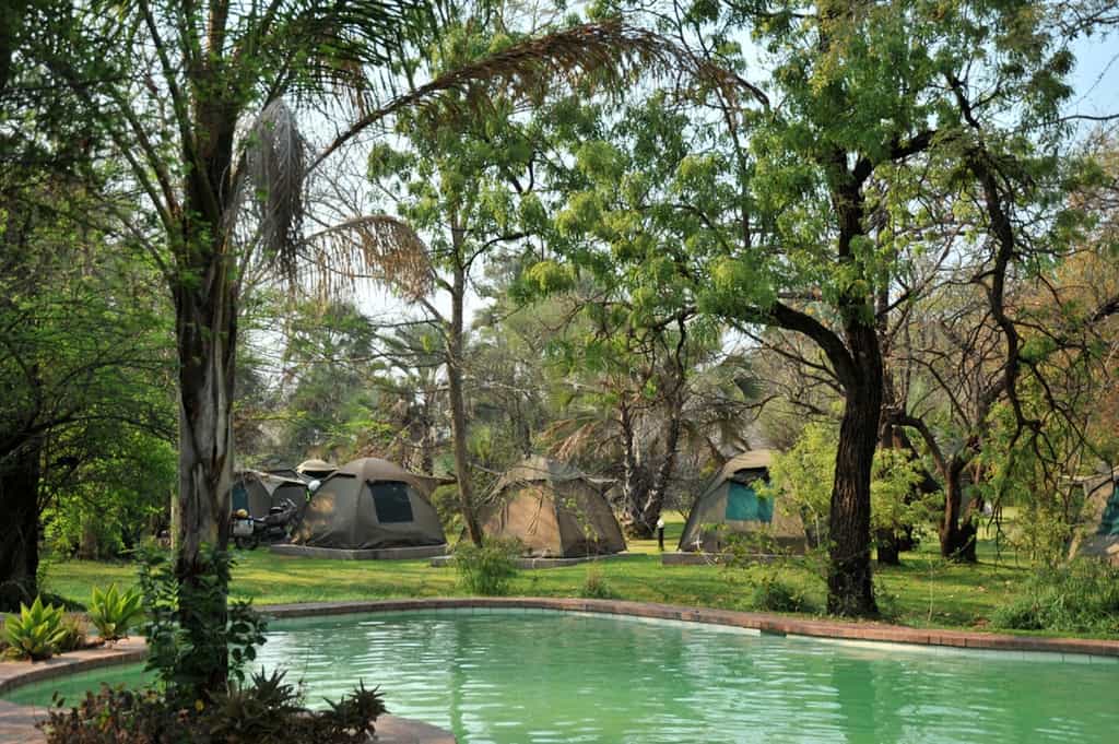 Permanent tents, 2 single beds, fan, light, shared ablution blocks with campsite.