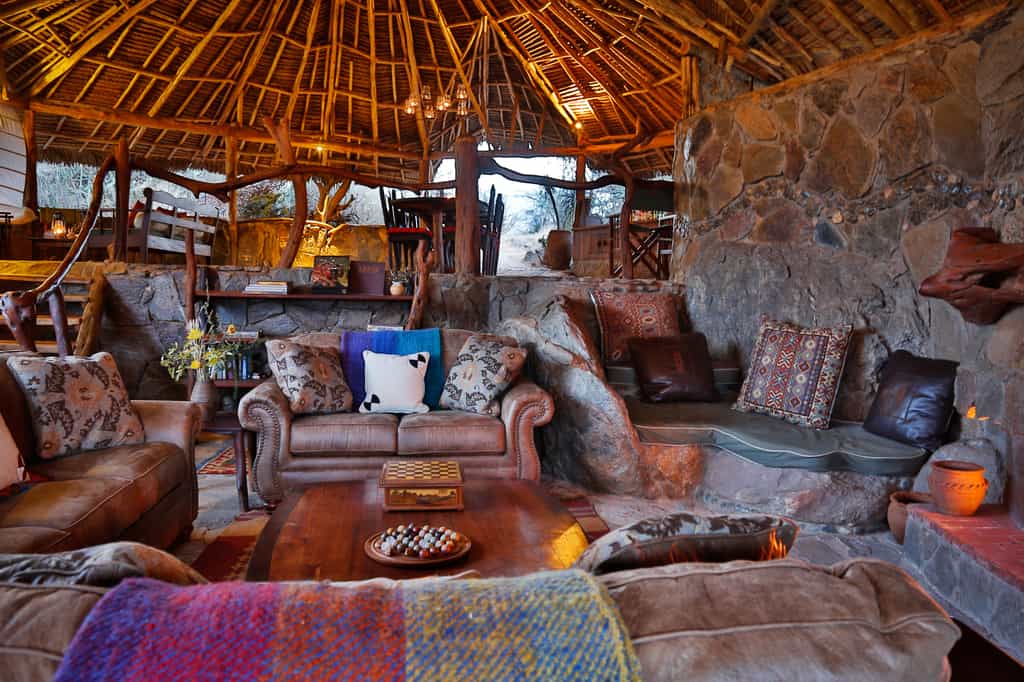 Main lounge area with log fire and cozy atmosphere