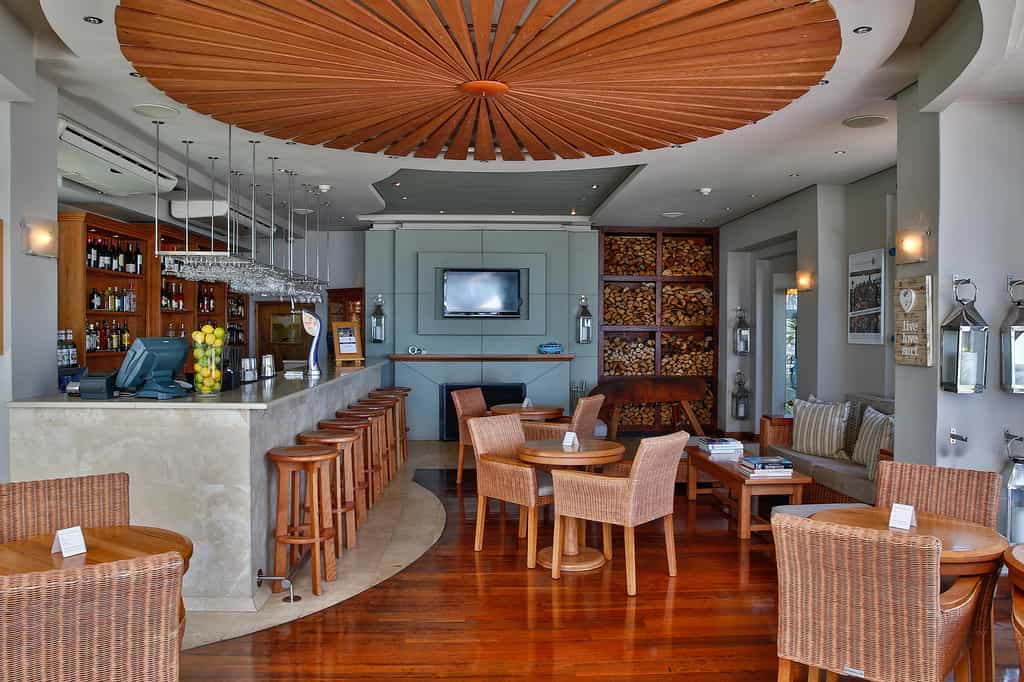 View of bar, fire place and seating area