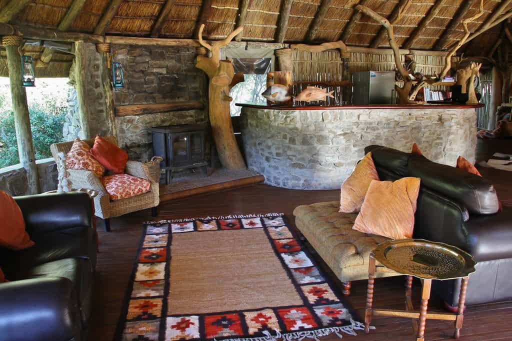 Richly coloured local textiles, in shades of rust and burnt orange, are used throughout in support of the regions weaving community