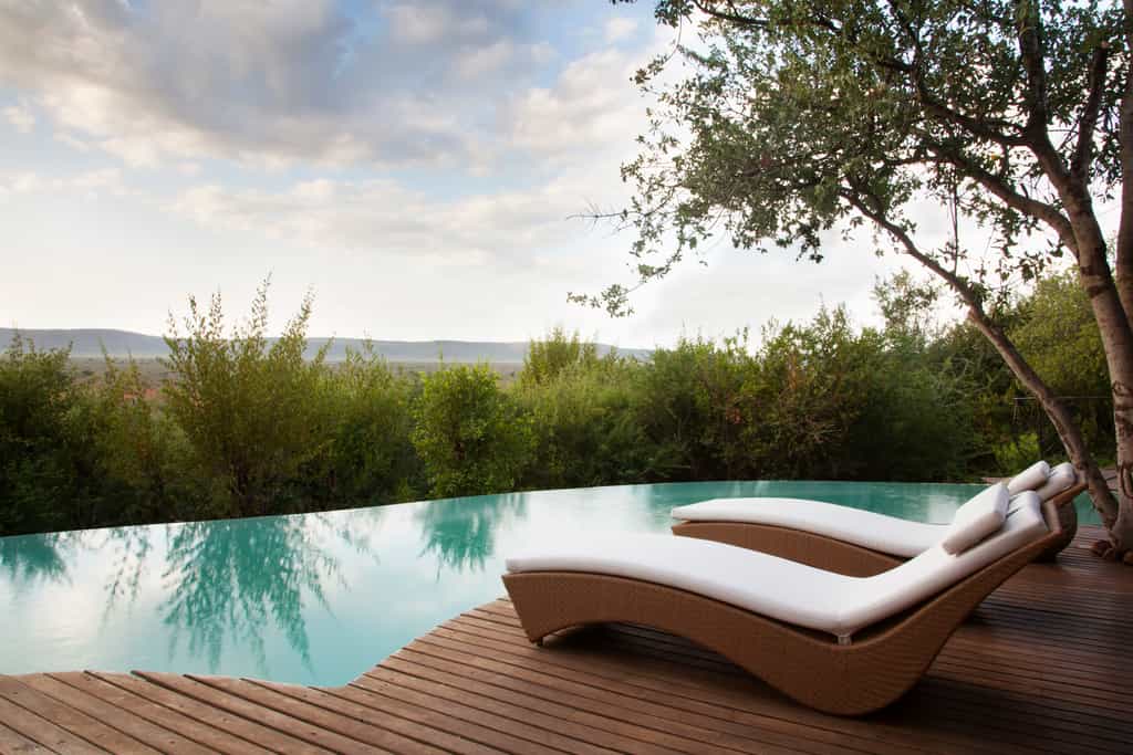 Molelo private pool deck & loungers overlooking the expansive Madikwe