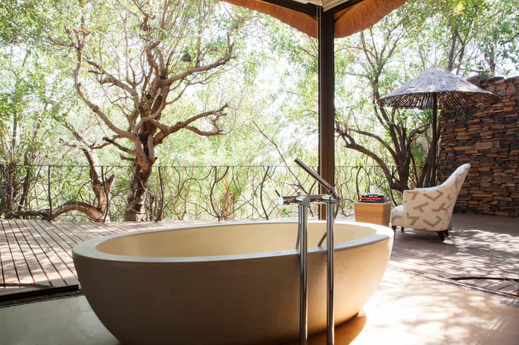 Master bedroom bath overlooking the private pool deck 