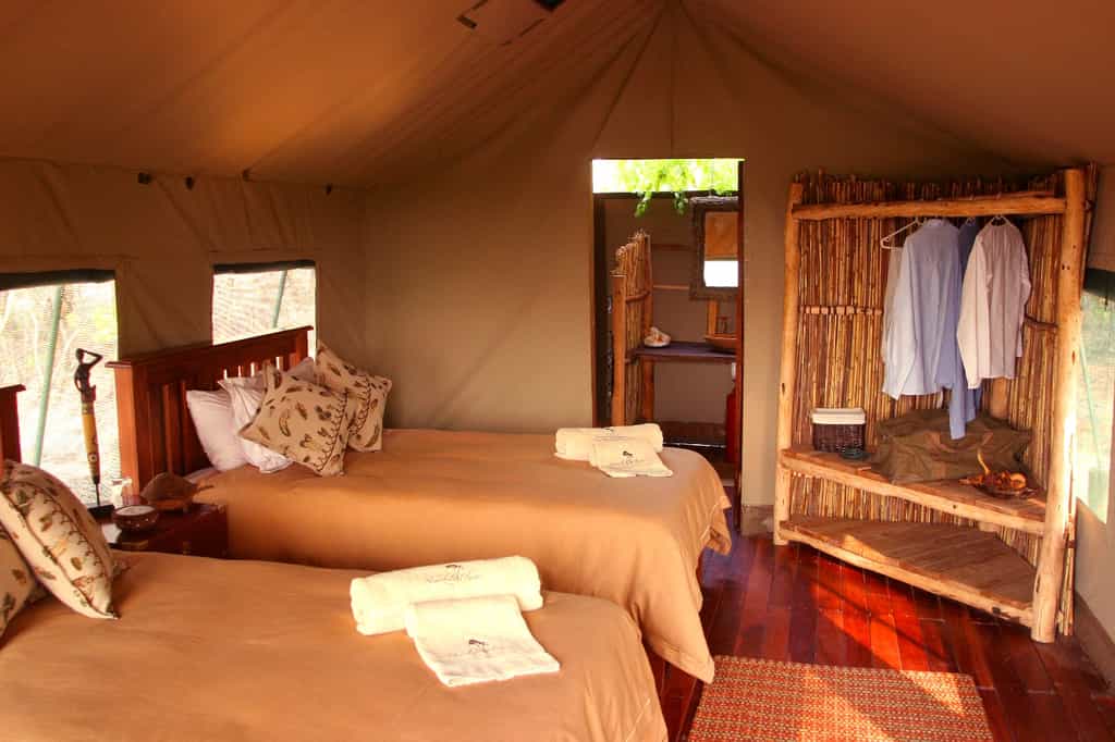 Twin bed arrangement in tent