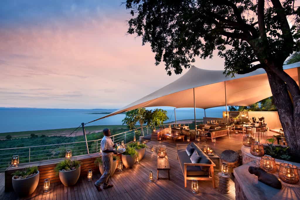 Dinner and wine on the shore at sunset 