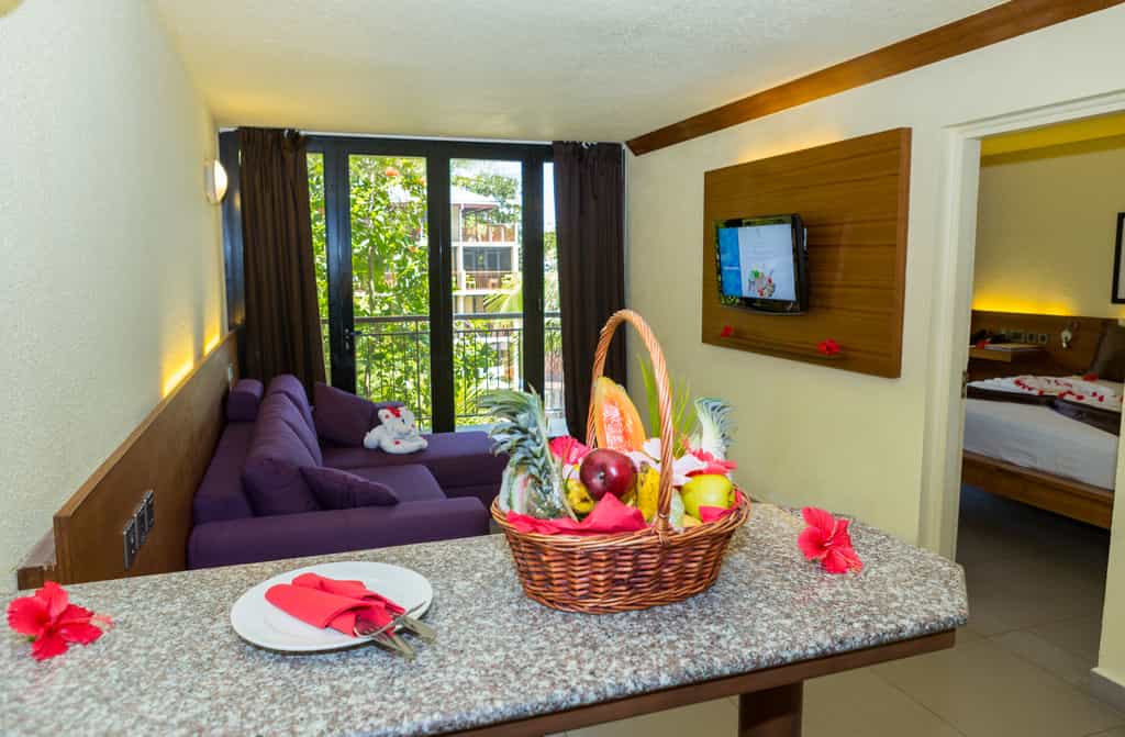 Deluxe room with one bedroom, one living room and bathroom.