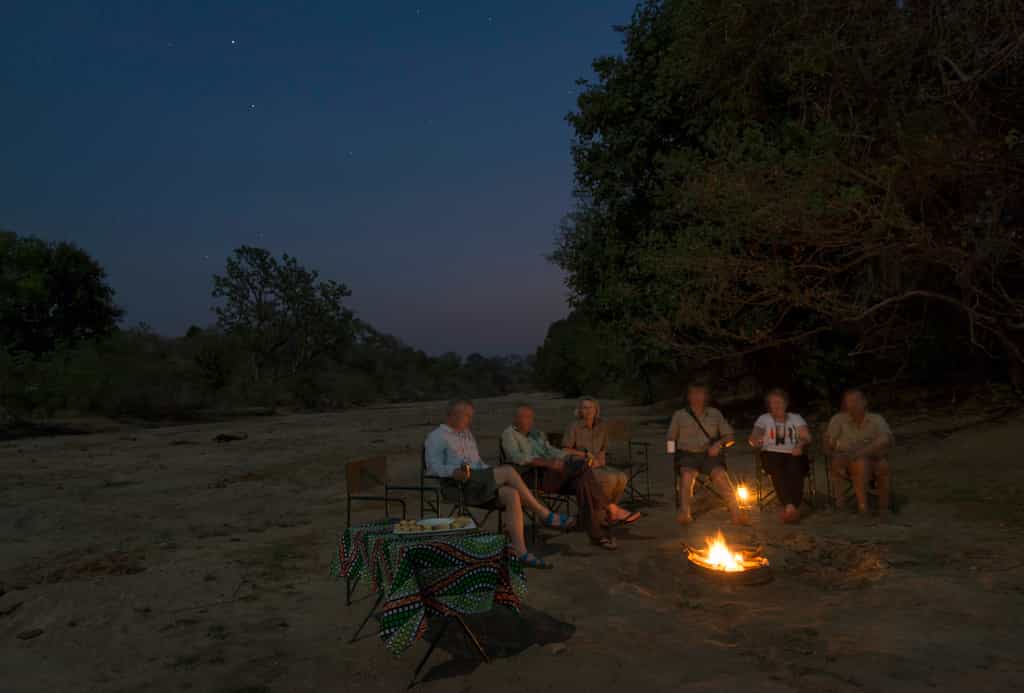 After dinner sit and unwind under the expanse of the African sky.