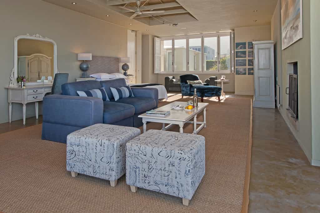 Seating area and window facing a beautiful mountain view