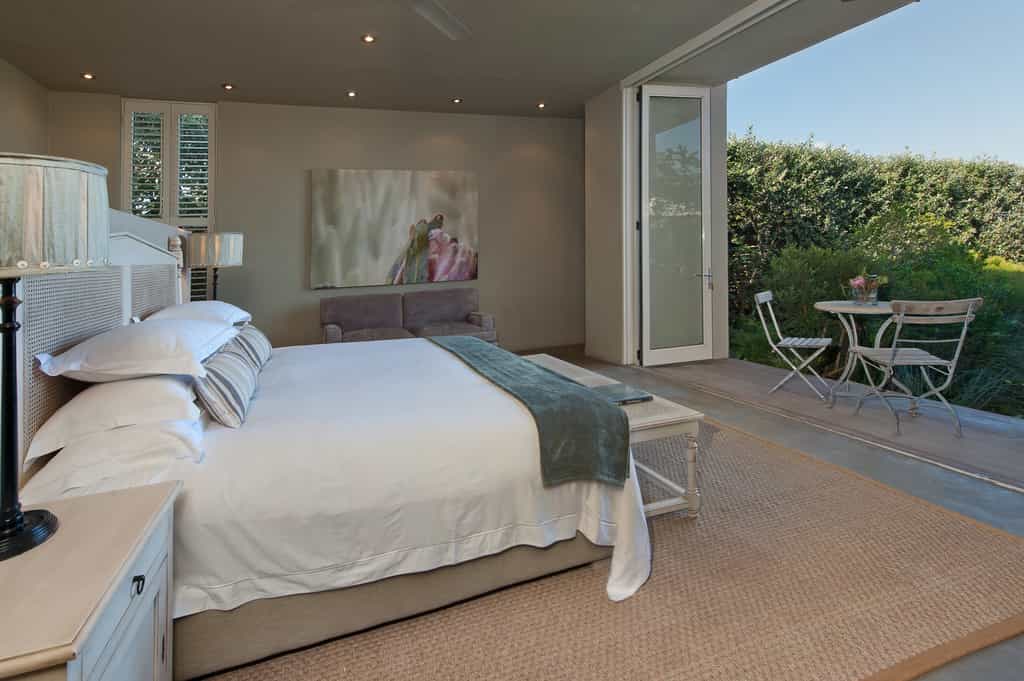 King bed and large stack doors opening onto the balcony