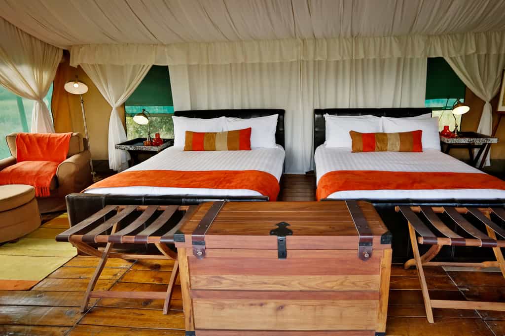 The tents all enjoy queen size twin beds.  All are ensuite with flushing toilets and hot showers.  Power is provided by an inverter and available 24 hrs a day.  Very spacious with lots of room to relax and unwind