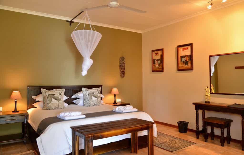 Double Chalet featuring king-size bed, en-suite bathroom, air-conditioning, refreshment station and private veranda with views of the Chobe River.