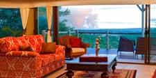 The main lounge area with views of the spray of the Victoria Falls