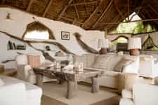 Perched on the banks of the Rufiji River, the main lounge is the perfect place to enjoy watching lazy hippos and crocs with a good book to keep you company.