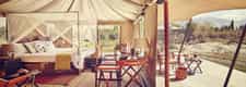 Private patio attached to each tent, furnished with hand-picked contemporary items with a nomadic theme, Intricately designed wooden chandeliers, Modern amenities like air-conditioners and heaters, Comfortable memory foam mattress that moulds perfectly to give you a good night’s sleep, The most luxurious fabrics, and a great selection of soft duvets and pillows, A writing desk, with custom stationery, A mini-bar and a complimentary welcome hamper, En-suite bathroom, A large cupboard, with an electronic safe, Shower cubicle with round-the-clock hot and cold water, Hair dryer and shaver socket, Custom-made bedroom slippers, eye masks and earplugs