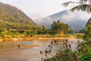 Go on a long tail boat ride down the Mae Kok River