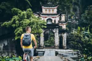 Cycle through the field to Bich Dong Pagoda temples