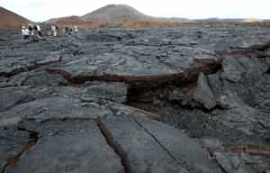 Walk across Bahía Sullivan's lava formations
