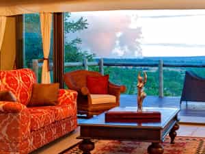 The main lounge area with views of the spray of the Victoria Falls