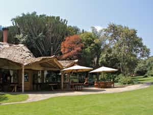Overlooking the water pond, the lawn is a great outside dining area with a perfect view of the sanctuary