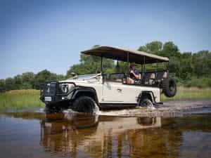 Land Rovers to transfer you into camp across Delta flood plains