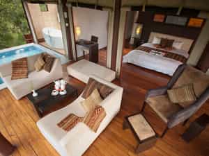 The honeymoon suite features a Jacuzzi, a plunge pool, extremely spacious with an open plan sleeping and living area, complete fireplace, a bathroom providing both a massage, open air bath (if desired).