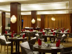 Savor the essence of authentic international cousin at Grand Savoy. Choose between unique outdoor seating and dine surrounded by water pools or simply enjoy welcoming atmosphere of air-conditioned top class buffet restaurant