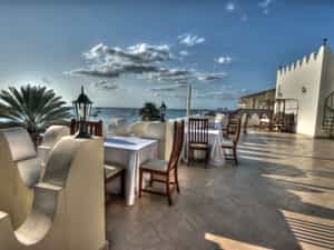 breakfast , lunch and dinner restaurant with a nice vie of the indian ocean