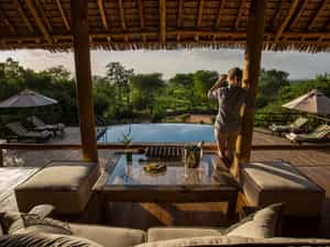 Lounge room overlooking the pool and waterhole
