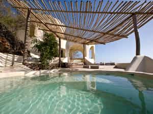 A day pavilion with plunge pool and sun lounger for relaxing 