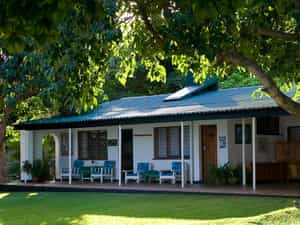 Spacious bedrooms open onto shady garden, leading down to the swimming pool and lake. 