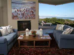 Our main lounge with a huge fireplace and beautiful view of the natural Fynbos Garden 