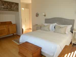 En suite bathroom with shower, bath, underfloor and towel rail heating as well as separate toilet.