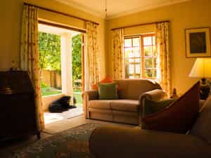 The lounge leads on to a small private patio which overlooks the swimming pool.