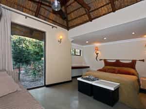 Queen size bed with bathroom with shower en suite
