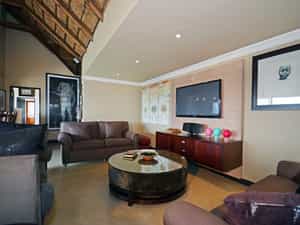 Lounge with TV and bar area