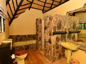 Old style bathrooms, with toilet, basin, shower and bath.