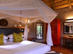 Master bedroom upstairs with bathroom en suite (with a walk-in rainfall shower), vanity unit, floor-to-ceiling sliding doors and balcony. Telephone and room safe. 1 en-suite bedroom downstairs (with a bath and rainfall shower) and a room safe.