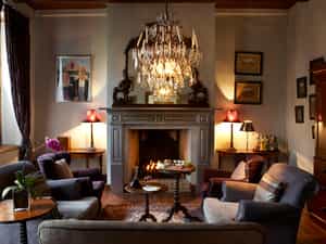 The Lounge offers a fireplace, comfortable couches and an honesty bar with a fine single malt collection. 
