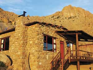 Each of the natural rock chalets sits between massive granite boulders and contains a bathroom, kitchenette, fireplace and private veranda.