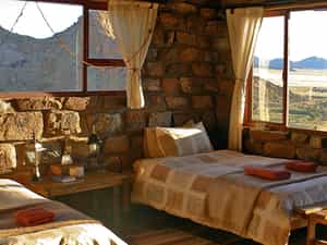 Each of the natural rock chalets sits between massive granite boulders and contains a bathroom, kitchenette, fireplace and private veranda.