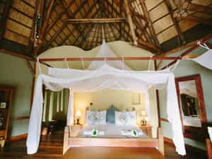 Large ensuite bedrooms with a combination of double and twin beds and an additional day bed.  A writing desk, small lounge and private deck to enjoy the views