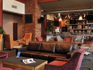 At the long, steel aircraft wing that is the bar, sink into a comfortable couch and relax as you watch the aeroplanes cruise to the landing strip. The lounge provides a peaceful setting with Wi-Fi access where business travellers can conduct informal meetings.