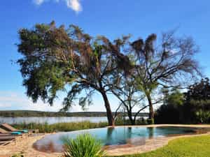 Infinity pool between the house and the river - a perfect place to relax