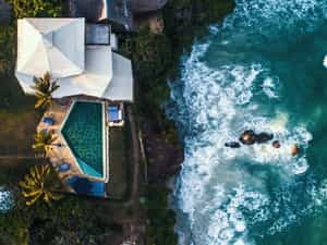 Aerial view of cliff villa at high tide