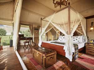 Nothing speaks more subtly about the elegance of brand TUTC than our Luxury Suite Tents. Beautifully-furnished and spacious, these tents rest royally on thick wooden decks, and treat you to a spellbinding 360° panorama of mystical mountains that encircle your location.  Whether you are on the king sized bed or in the stylish bathroom, views from the huge netted windows won't let you forget the magical landscape that envelops you. The triple layered tents, with their natural insulation ensure you stay warm and comfortable. Anti-weathering and fire-resisting fabric reinforces your security as our top priority.