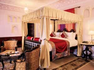 Lay out of Maharaja Room with four poster bed